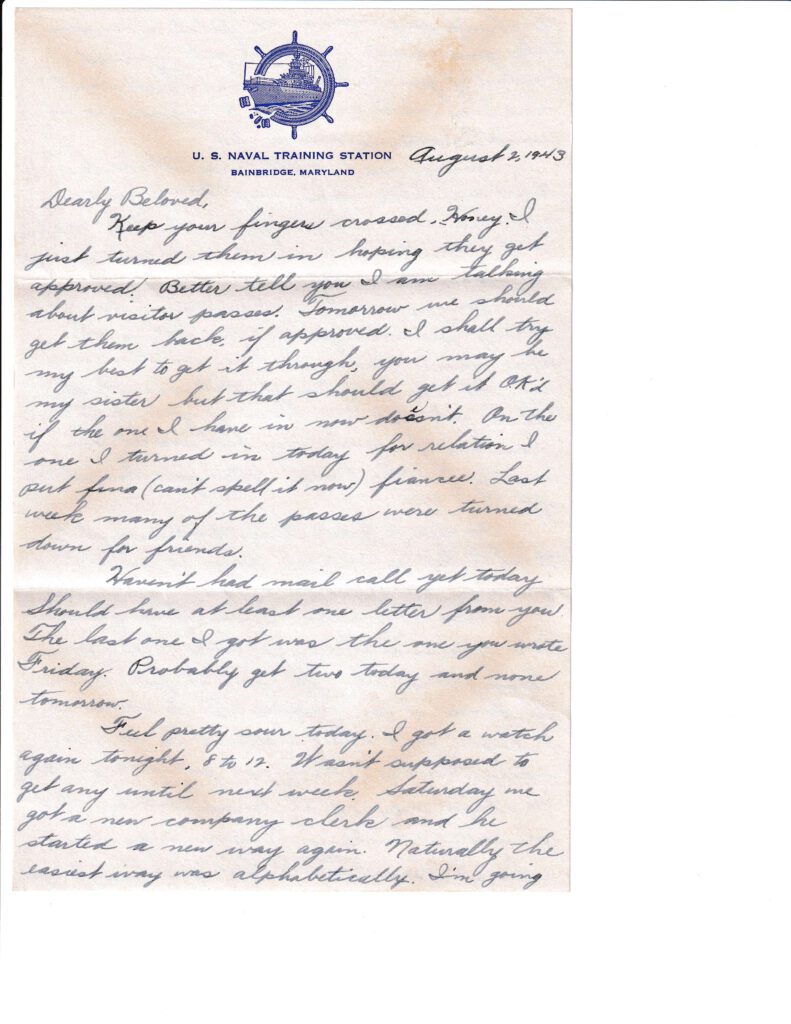 A handwritten letter on lined paper with blue ink and cursive handwriting.