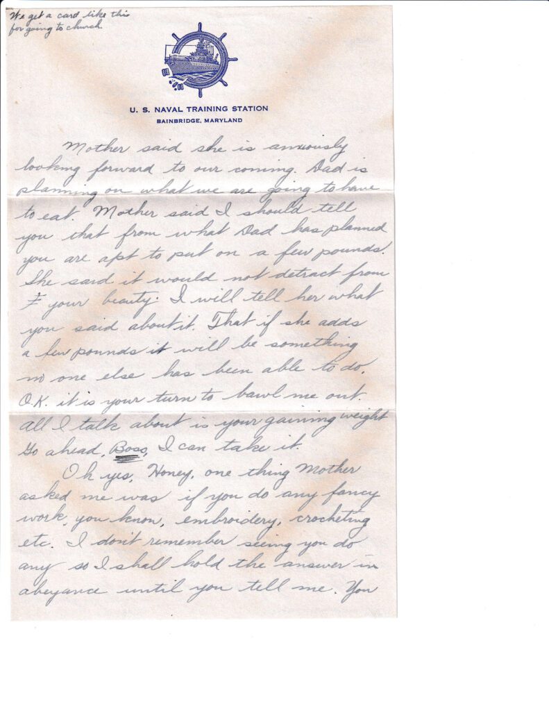 A handwritten letter on branded stationery with cursive writing and some stains.
