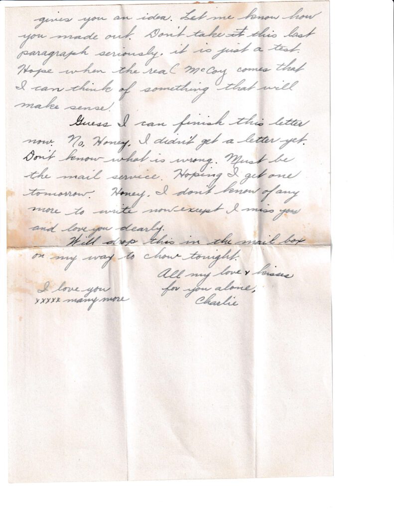 A handwritten letter on aged paper with visible folds and stains.