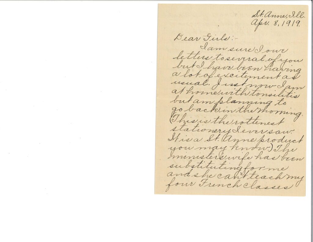 A handwritten letter on cream paper with cursive script.